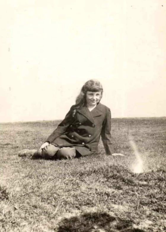 Margery Yeates sitting on grass