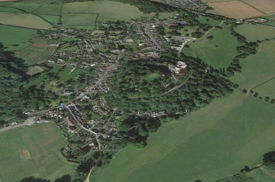 Aerial View of Dunster, with village dominated by Dunster Castle