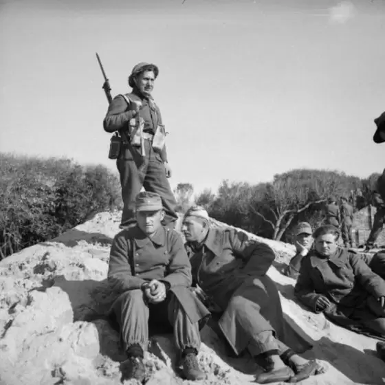 Anzio - British soldier guarding German prisoners