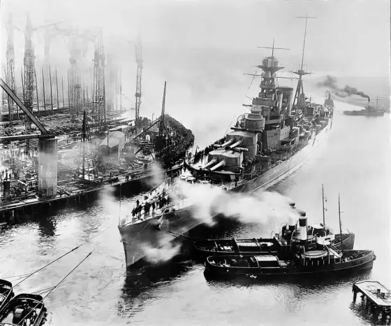 Photograph of the Admiral Class battlecruiser, HMS Hood being towed out of John Brown & Co's shipyard at Clydebank shortly after completion. 
Image courtesy of National Records of Scotland.