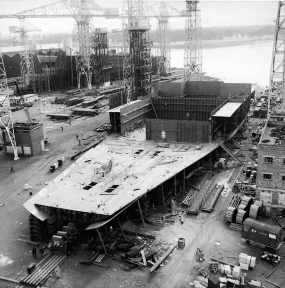Construction of the hull of the Cunard liner RMS Queen Elizabeth 2 at the shipyard of John Brown & Company, Clydebank. 
Image courtesy of National Records of Scotland.